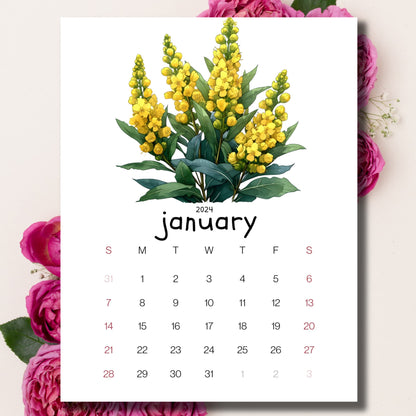 Mahonia Magic January 2024 calendar laid on a beige background with pink peonies behind.