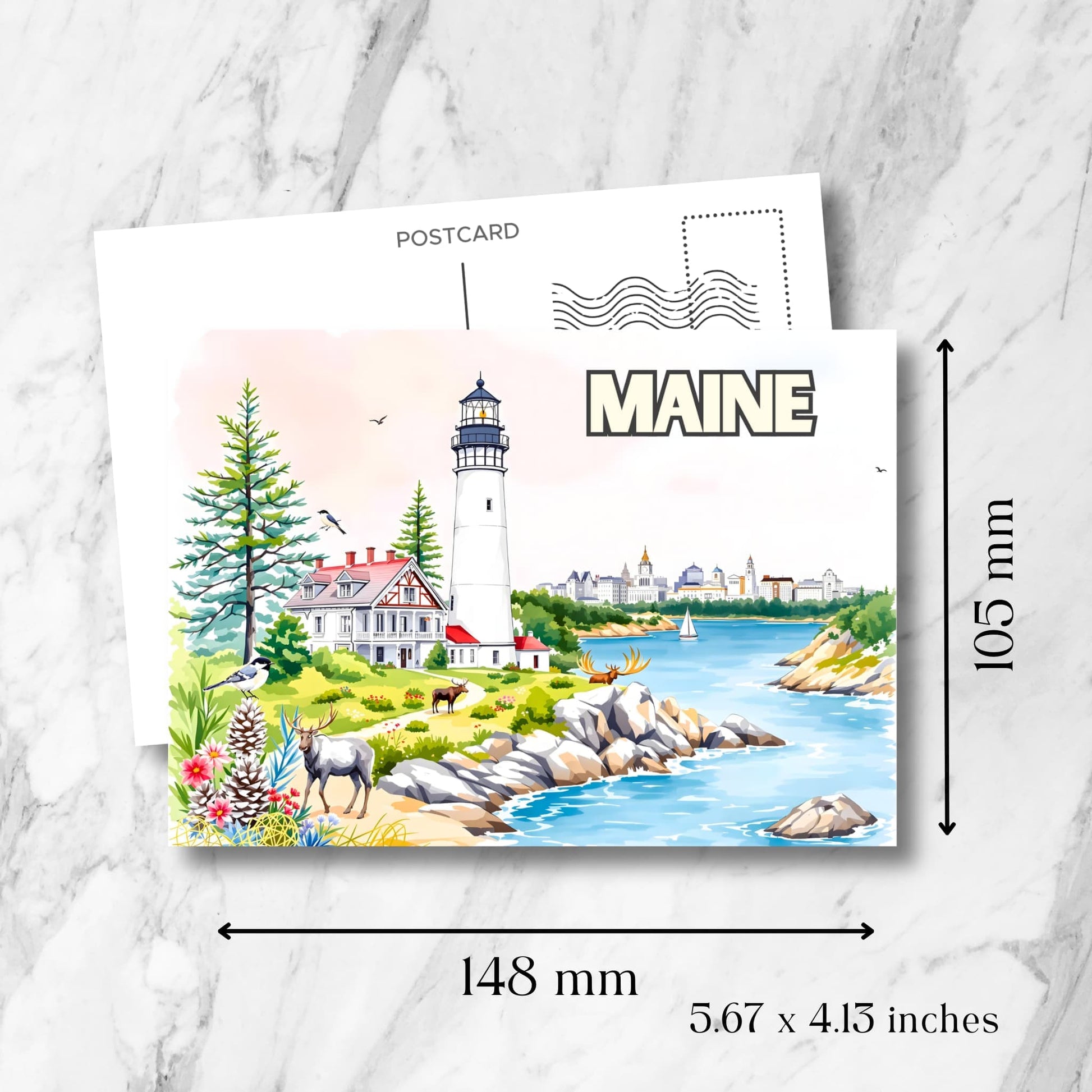 Maine lighthouse postcard showing dimensions of 148x105mm. Features coastal scene with pine trees, moose and rocky shoreline on marble background.