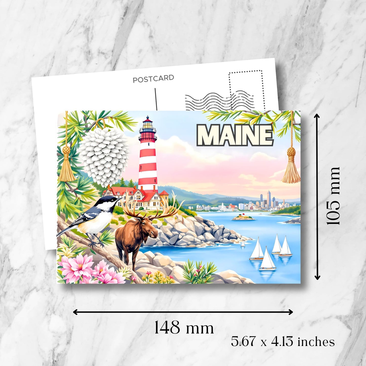 Maine lighthouse postcard showing dimensions of 148x105mm. Features red-striped lighthouse, moose, chickadee and pine branch decorations.