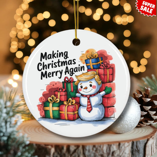 Festive ceramic ornament with patriotic snowman design displayed on wood slice with pinecones and warm twinkle lights, featuring Super Sale promotion.