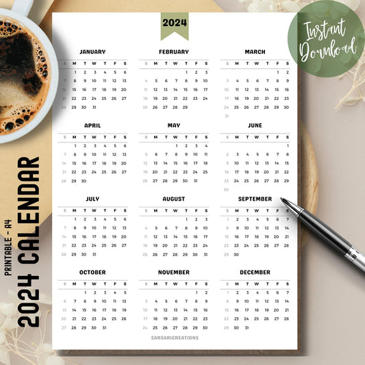  Minimalist 2024 full year calendar printed page on brown desk with coffee cup on left and pen on right.