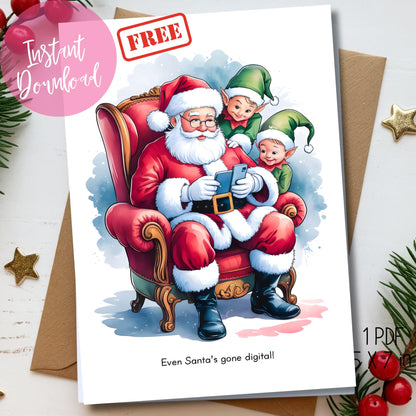 Funny holiday card with watercolor illustration of Santa and elves looking at mobile phone in vintage chair, modern humor Christmas message, shown with kraft envelope and pine greenery