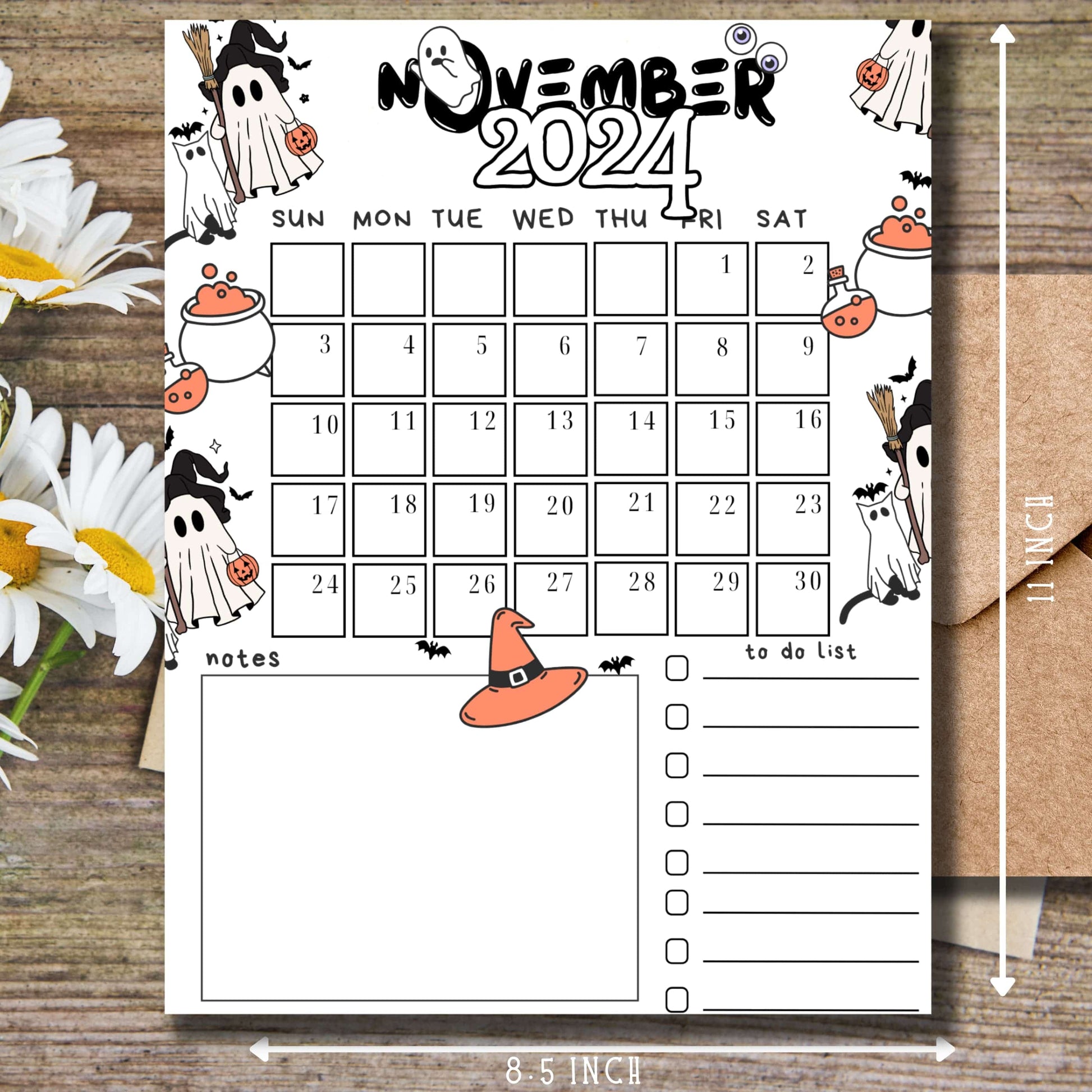 8.5 x 11 inch November 2024 calendar with size measurements. Features playful ghost illustrations, witch hat, and cauldron designs. White background with daisy flower accents and complete to-do list section