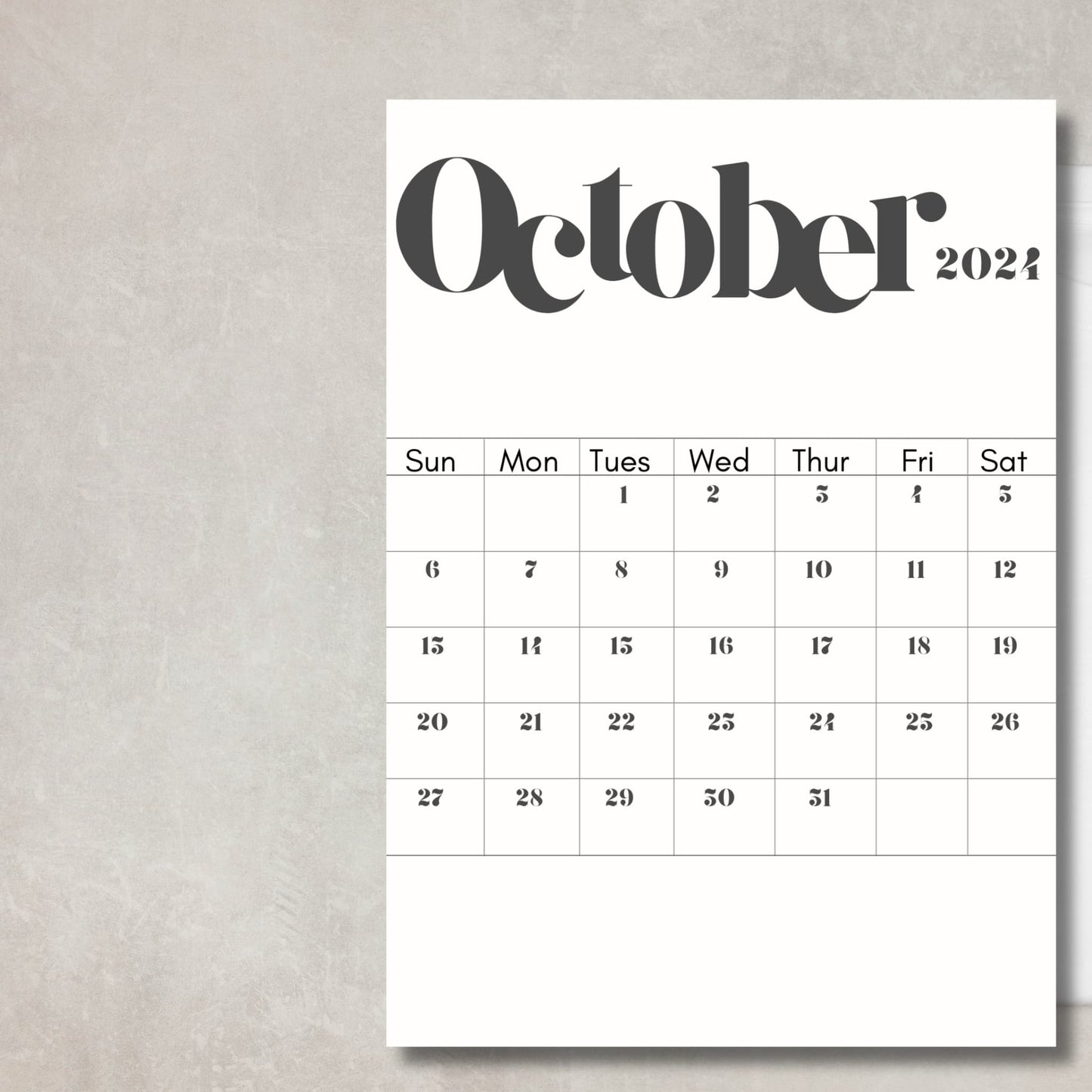 October 2024 printable calendar placed on light grey table