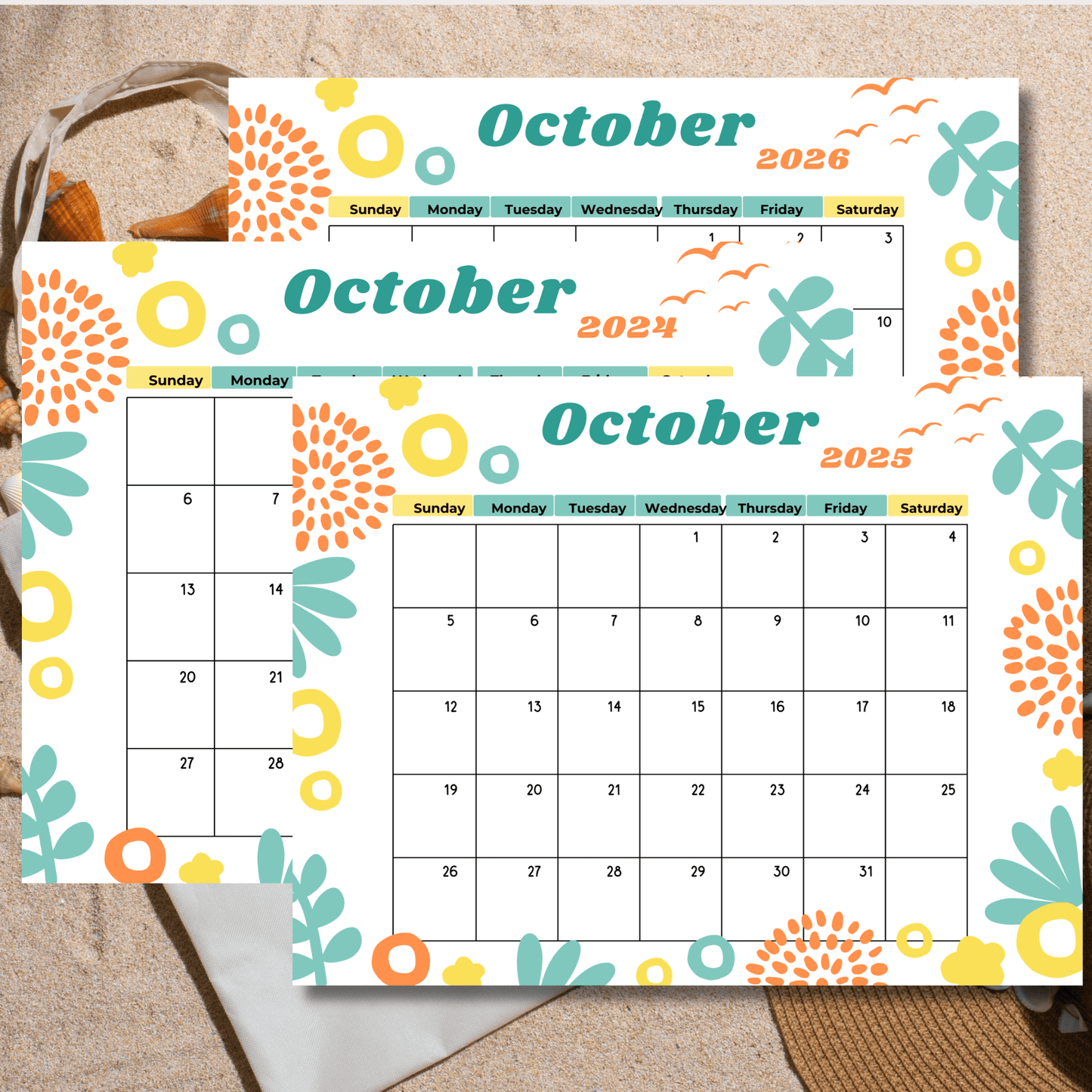 Colorful October 2024-2026 calendar pages with abstract designs, arranged on a sandy beach background.