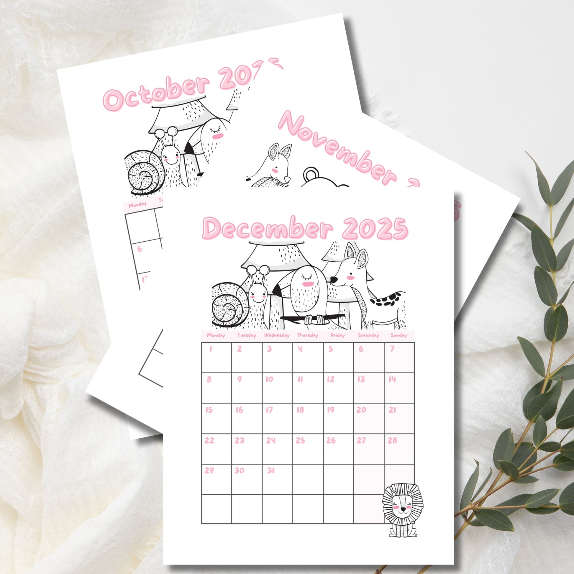 December 2025 calendar with woodland creatures line art and pink numbering. October-November pages peeking behind, Monday-start grid with eucalyptus sprig decoration.