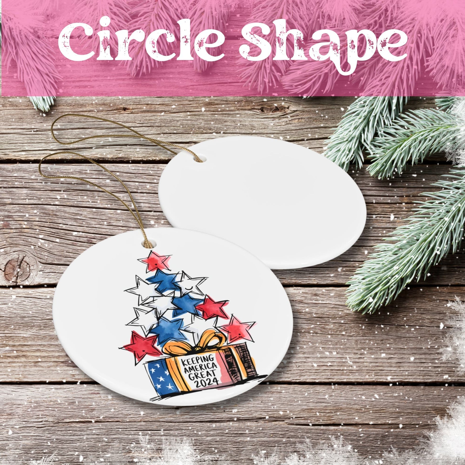 White ceramic circle ornament featuring red, white and blue stars arranged above a patriotic gift box design, displayed on rustic wood background with pine branches.