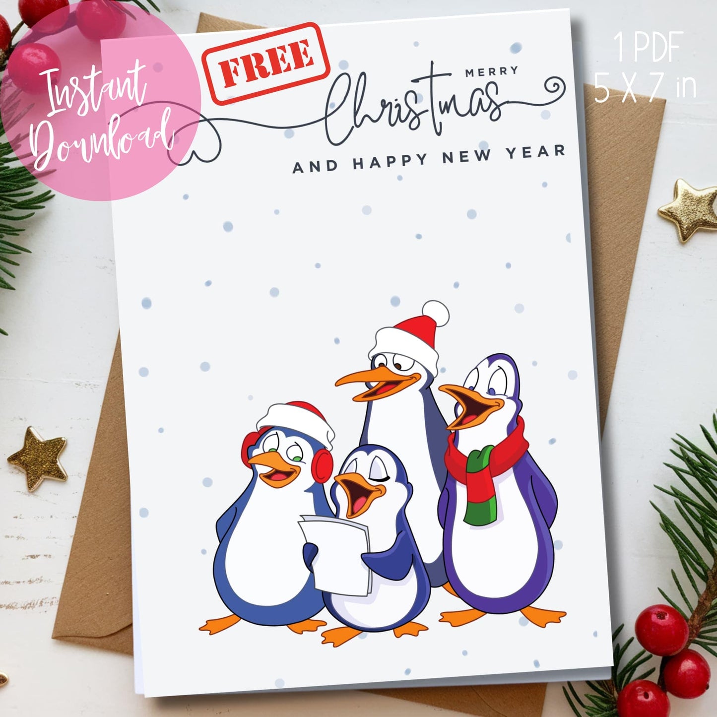 Free 5x7 holiday card featuring four cartoon penguins singing carols, wearing Santa hats and scarves, with snow dots and handwritten typography, shown with kraft envelope and festive greenery