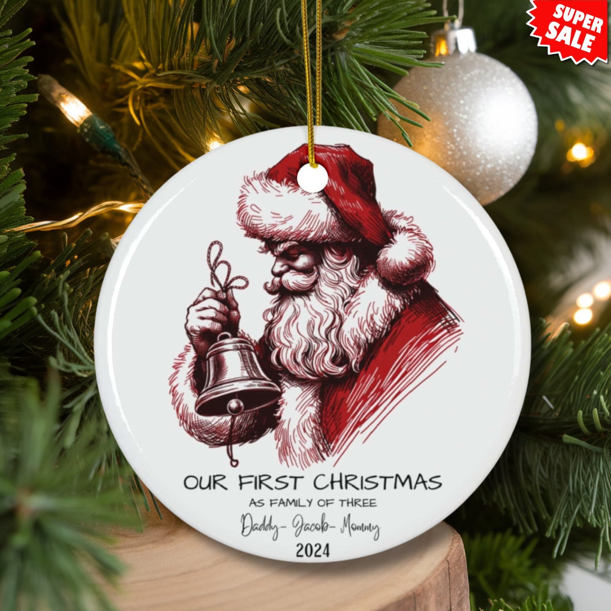 Personalized Santa ornament displayed on lit Christmas tree with white baubles and Super Sale label, showing complete festive setup