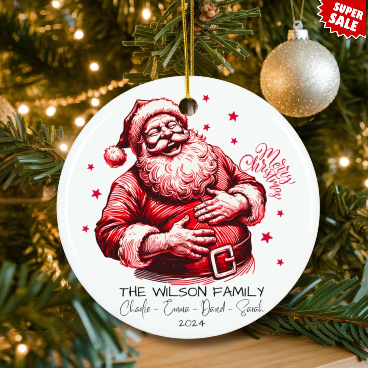 Personalized laughing Santa ornament displayed on lit Christmas tree with silver baubles and holiday lights, featuring Super Sale promotion.