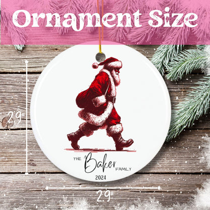 Size measurement showing 2.9-inch diameter of circular ceramic ornament with illustrated walking Santa and pine branches.