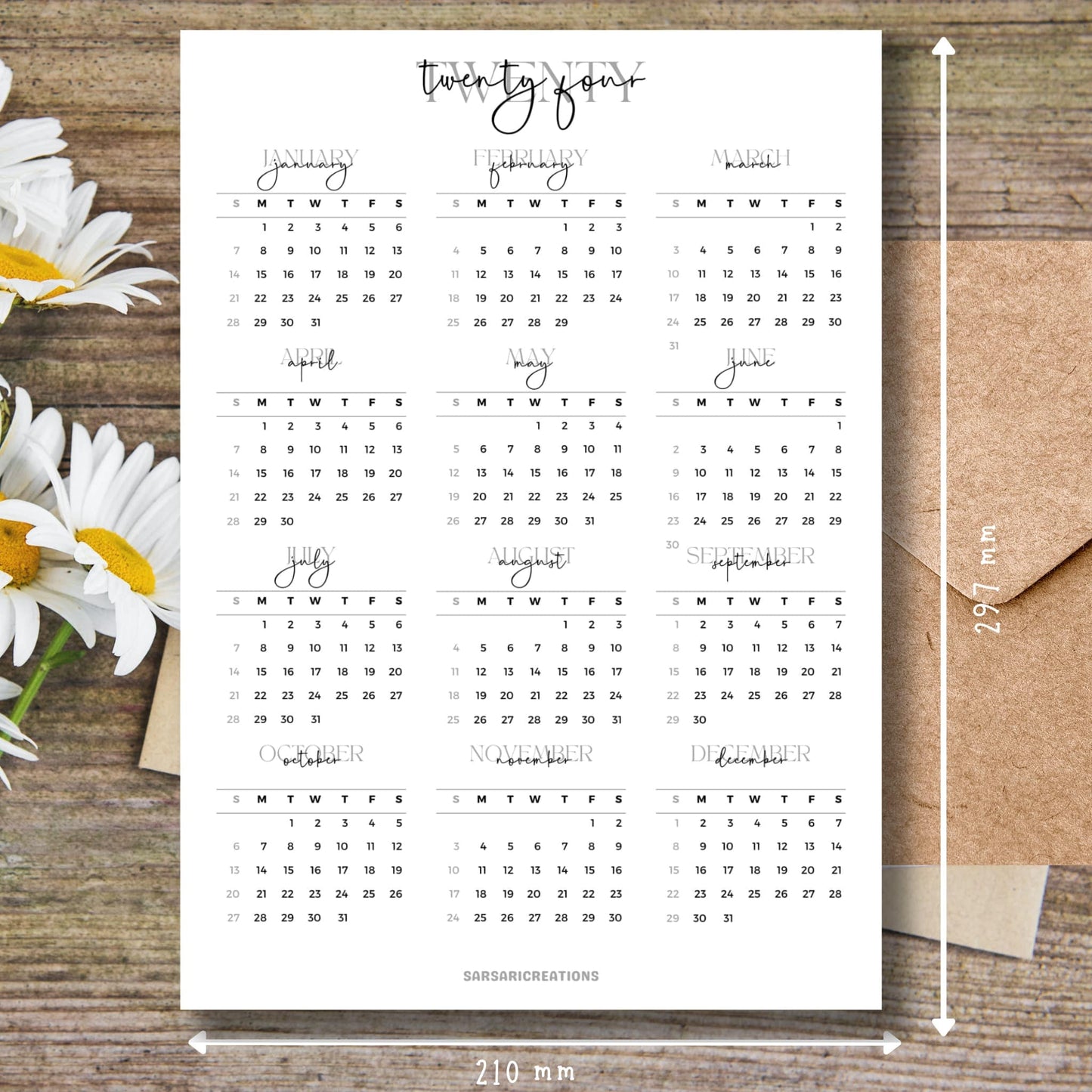 Script font style 2024 calendar printed page on brown wooden desk with white flowers and size guide. Third Image