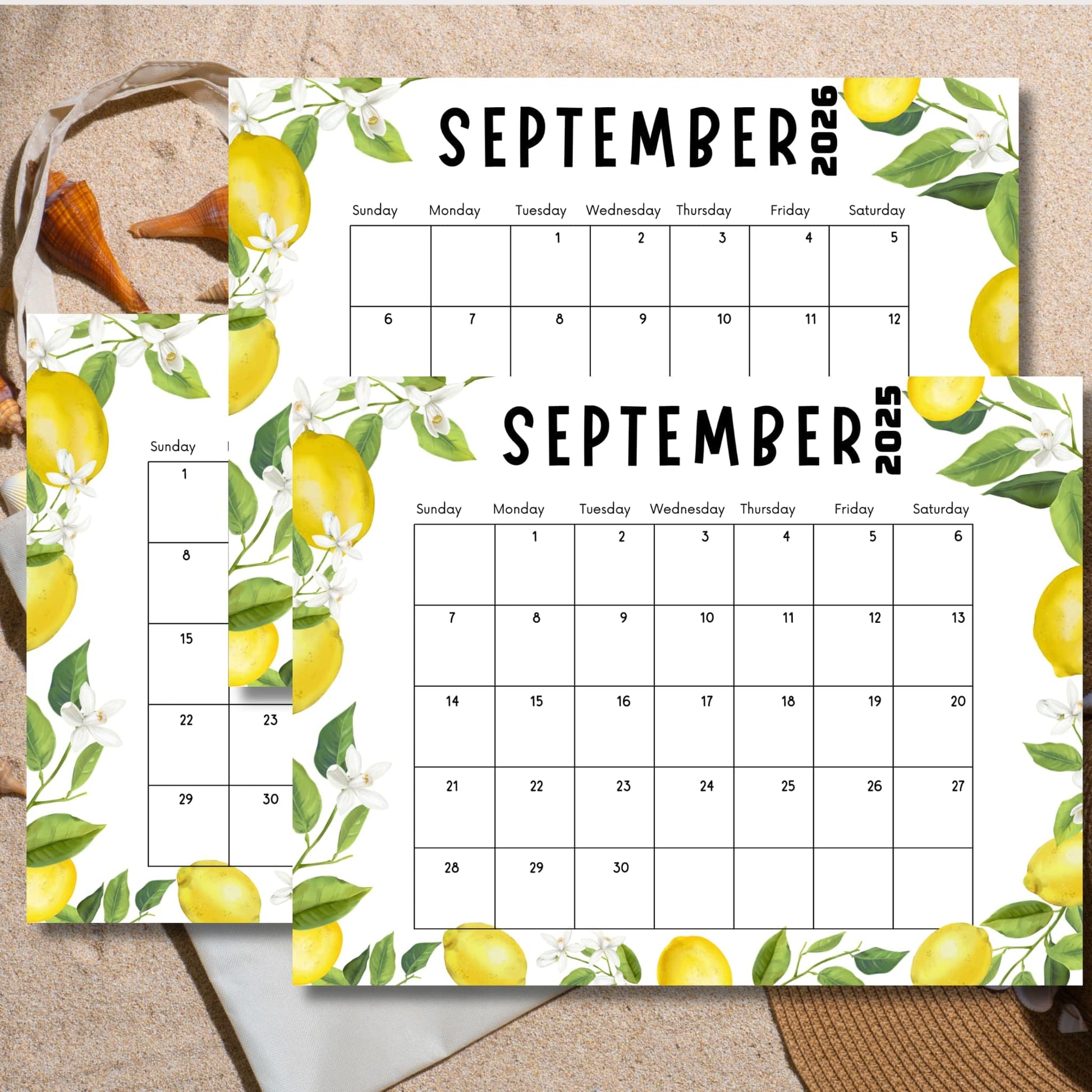 Lemon-themed September calendars on sandy beach background. Tote bag and seashells visible, showcasing calendar's summer appeal.