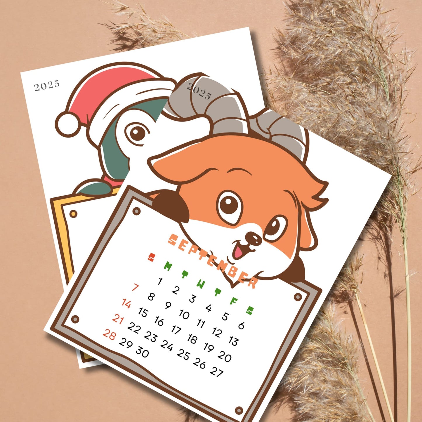 September 2025 calendar page with cartoon fox and penguin characters. Fox holds calendar grid with weekdays highlighted in green and red, displayed against natural pampas grass background.