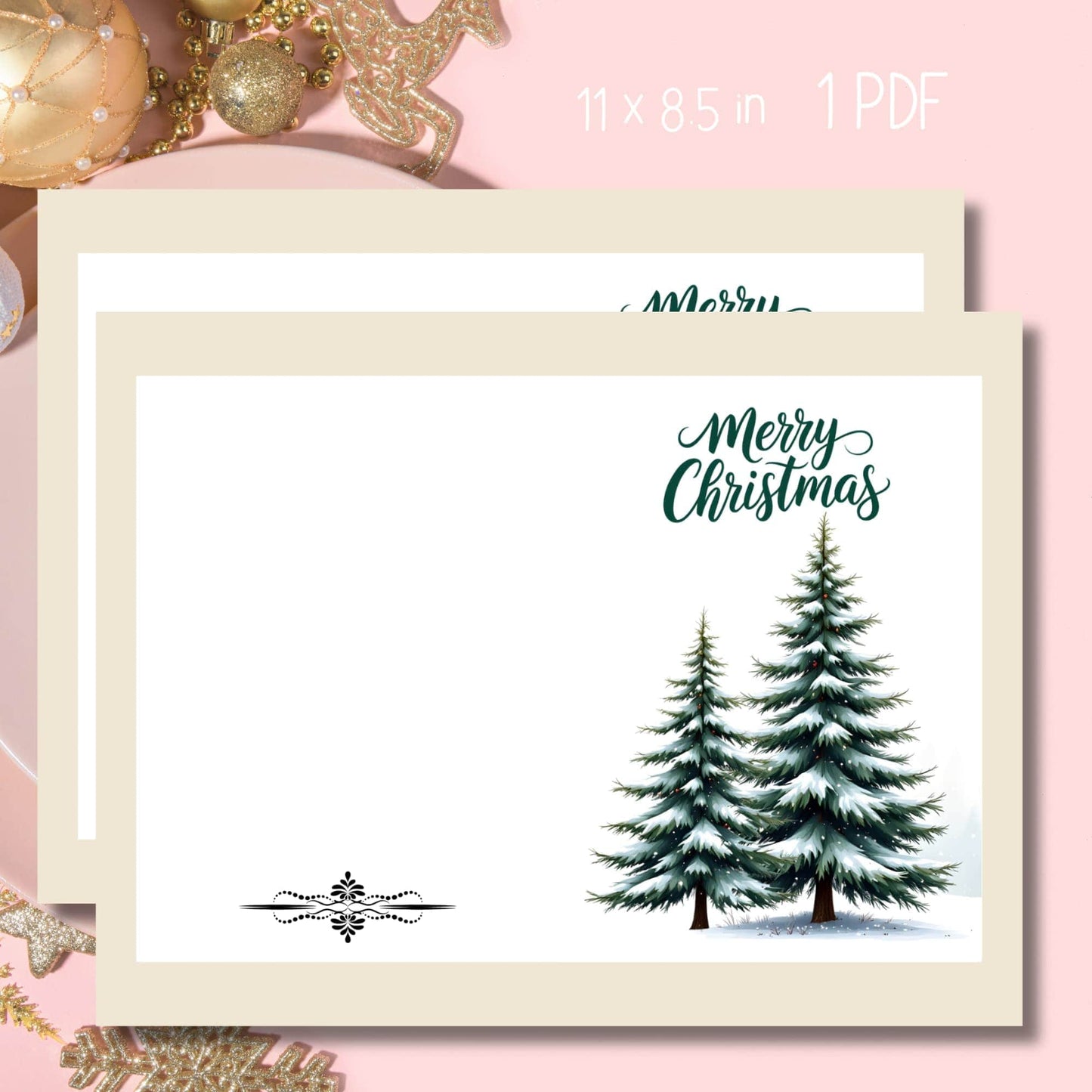 Free printable watercolor Christmas card featuring detailed snow-covered evergreen trees, forest green calligraphy 'Merry Christmas', and decorative black divider, shown with gold ornaments, 11x8.5 format