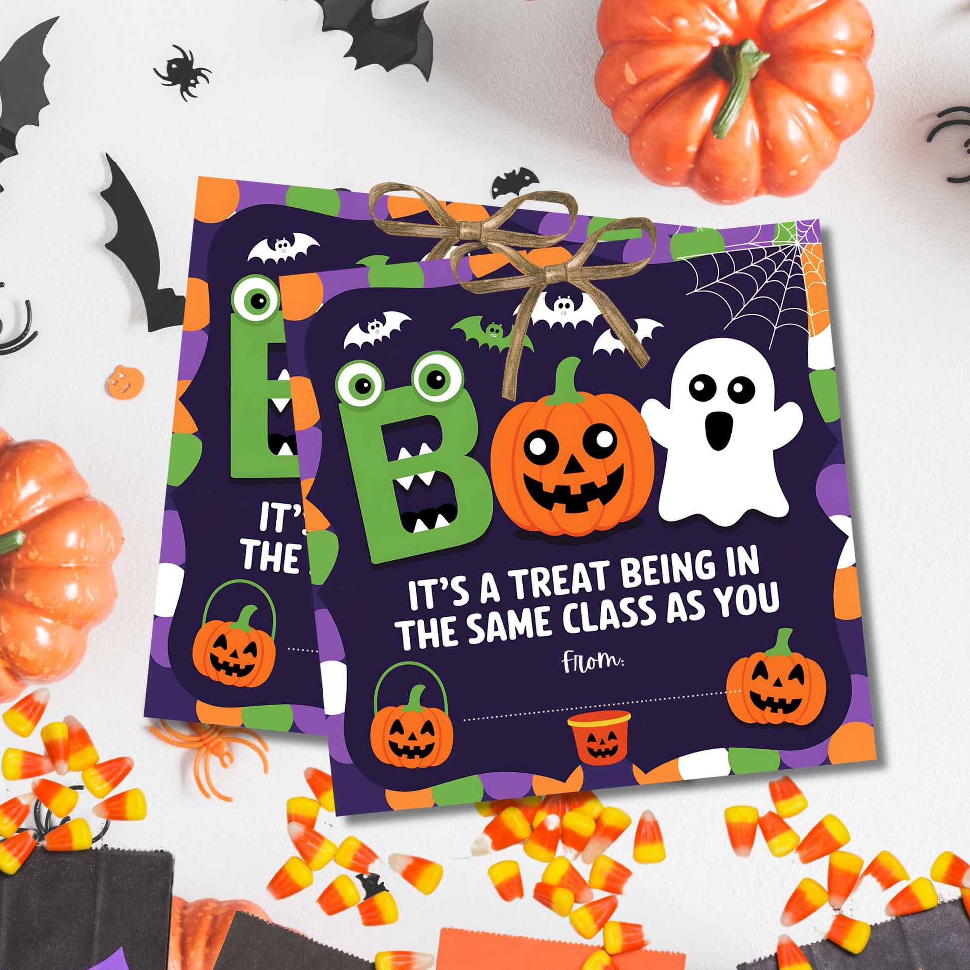 Purple BOO Halloween appreciation tags with cute monster, jack-o'-lantern, and ghost, arranged with pumpkins and candy corn for coworker gifts