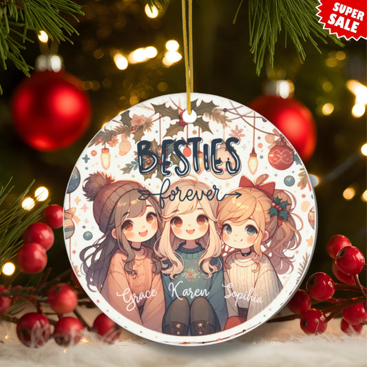 Festive display of Besties Forever ornament surrounded by red berries and Christmas lights, showing three kawaii friends in winter attire with customizable names, marked as super sale