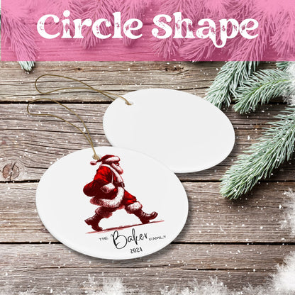 White ceramic circle ornament showing red vintage-style walking Santa illustration with personalized Baker Family text on rustic wood background.