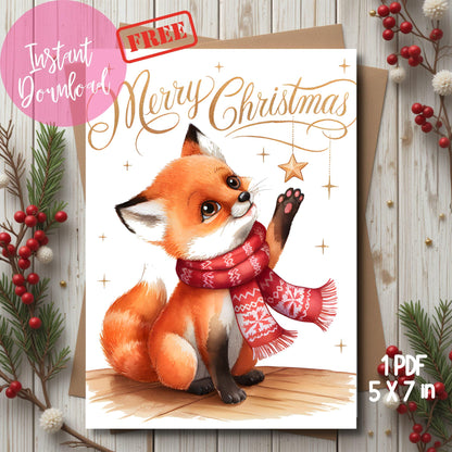 Free printable Christmas card with cute fox illustration in winter scarf, gold script lettering and star decorations, shown on rustic wood background with red berries and evergreen, 5x7 format